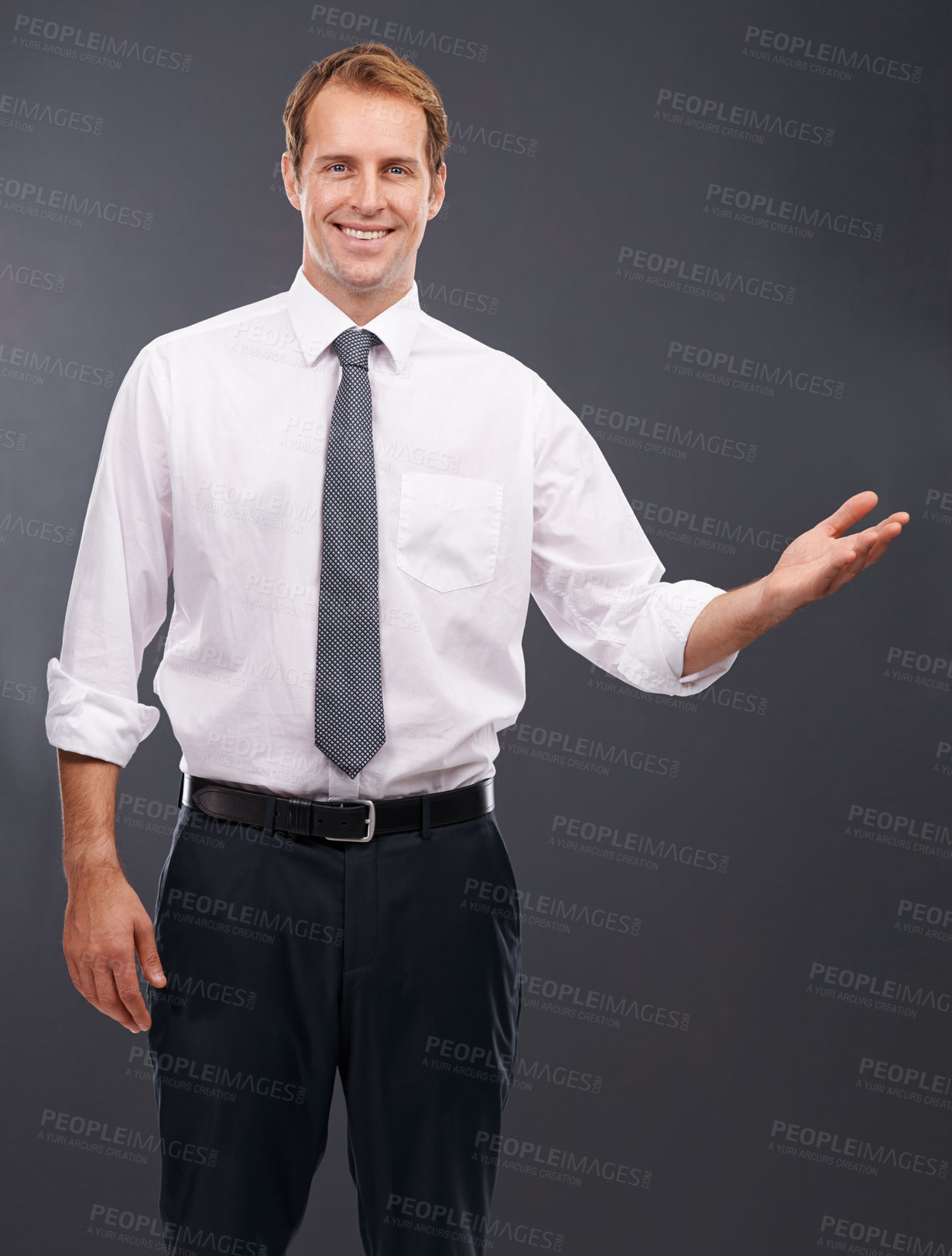 Buy stock photo Businessman, smile and hand with idea, showcase or profile against a grey studio background. Portrait of a isolated handsome young business man standing showing product, advertising or marketing
