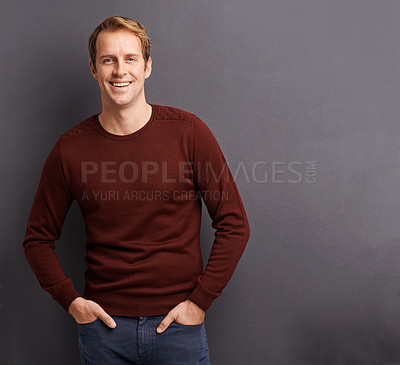 Buy stock photo Portrait of a handsome young man in a studio in front of a gray background