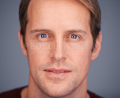Buy stock photo Closeup studio portrait of a handsome man with blue eyes