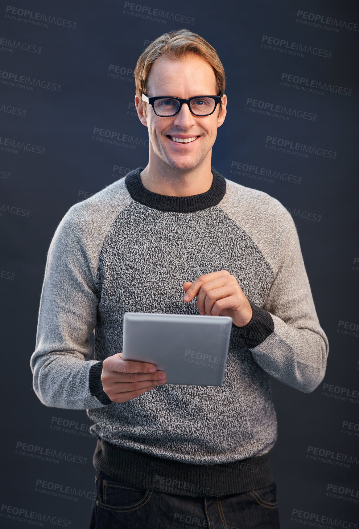 Buy stock photo Man, glasses and tablet in studio with smile for portrait, connection or contact by dark background. Person, entrepreneur or geek with digital touchscreen, pride or fashion with app for social media