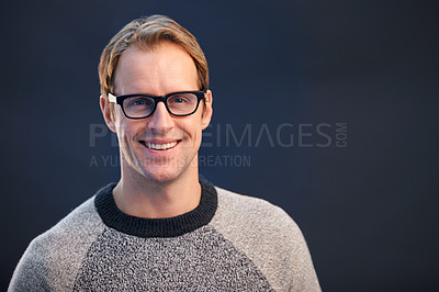 Buy stock photo Portrait, glasses and man with smile, optometry and confident guy on a dark studio background. Face, person and model with eyewear and clear vision with healthy eyesight and looking with wellness