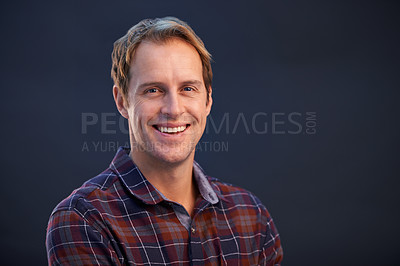 Buy stock photo Happy, nerd and portrait of man in studio, dark background and smile with pride or confidence in fashion. Geek, face and person with plaid pattern on shirt or relax in casual style on mockup space
