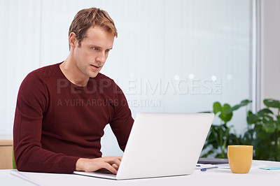 Buy stock photo Businessman, laptop and online research in office with paperwork as graphic designer. entrepreneur or project planing. Male person, typing and desk for creative agency or career, email or internet