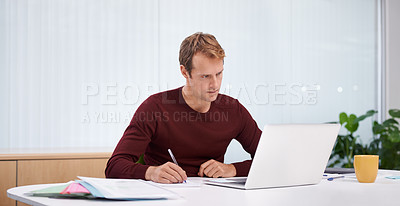 Buy stock photo Businessman, laptop and writing notes in office as digital designer for online project, research or paperwork. Male person, career and creative agency with documents for planning, startup or internet