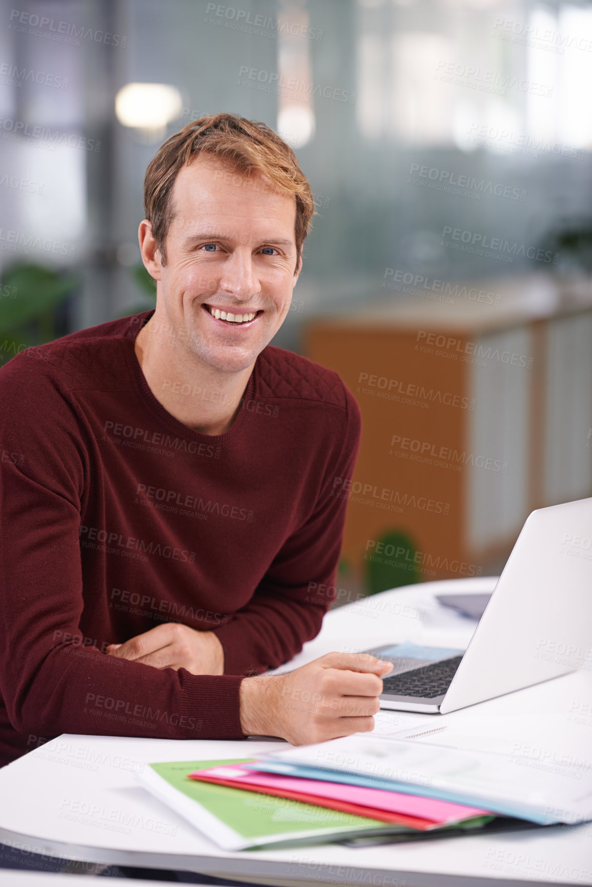 Buy stock photo Man, portrait and research paperwork at laptop or office at creative agency as graphic designer, project or job. Male person, face and smile at desk or small business, entrepreneur or brainstorming