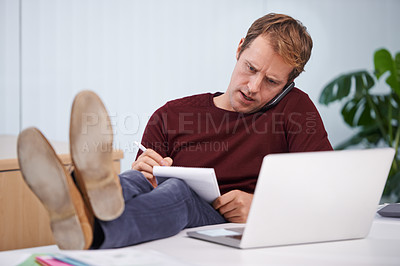 Buy stock photo Businessman, phone call and notes for office discussion at graphic designer for project planning, networking or client. Male person, laptop and communication and research, paperwork or contact us
