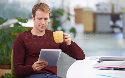 Buy stock photo Tablet, drinking coffee and business man research in office for internet or reading email in startup. Technology, tea cup and professional on website, networking or creative designer on social media