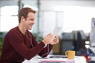 Buy stock photo Tablet, smile and businessman with earphones, watching at desk in office workplace. Happy, technology and business videos or  social media streaming, elearning or internet research for online project