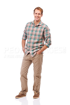 Buy stock photo Portrait of a handsome young man standing with his hands in his pockets against a white background