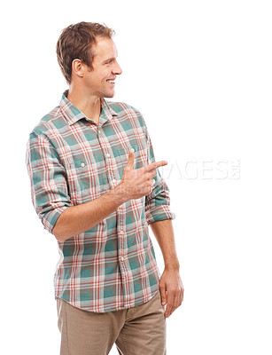 Buy stock photo Presentation, smile and man pointing to advertising space, marketing or mockup in studio isolated on a white background. Happy person, promotion and hand gesture to show information or sales offer