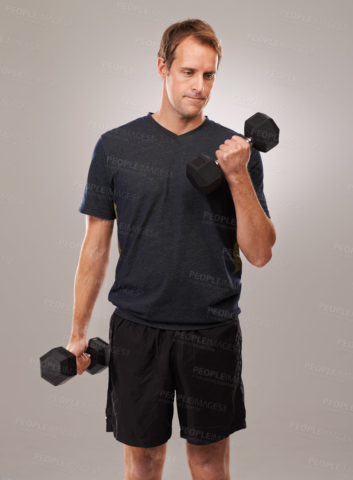 Buy stock photo Studio shot of a handsome young man in sportswear