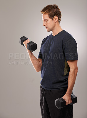 Buy stock photo Man, dumbbells and weightlifting workout in studio or fitness performance, training or grey background. Male person, equipment and wellness health or sport exercise or athlete, biceps or mockup space