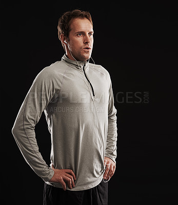 Buy stock photo Earphones, thinking or runner in studio for fitness, running workout or exercise with radio music or podcast. Breathe, athlete and confident sports man ready to start training on black background