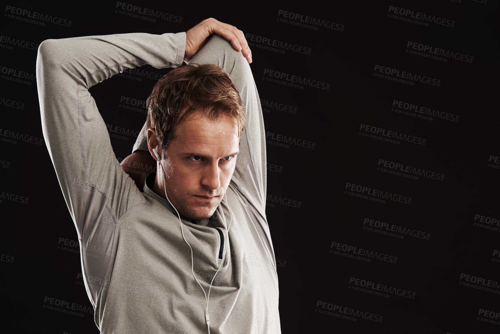 Buy stock photo Man, arms and stretching workout in studio or exercise training with flexibility, mobility or black background. Male person, fitness and earphones or music playlist with health, performance or mockup