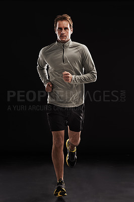Buy stock photo Man, portrait and cardio running in studio for athlete performance or marathon, training or black background. Male person, face and fitness sports with mockup space for health, workout or exercising