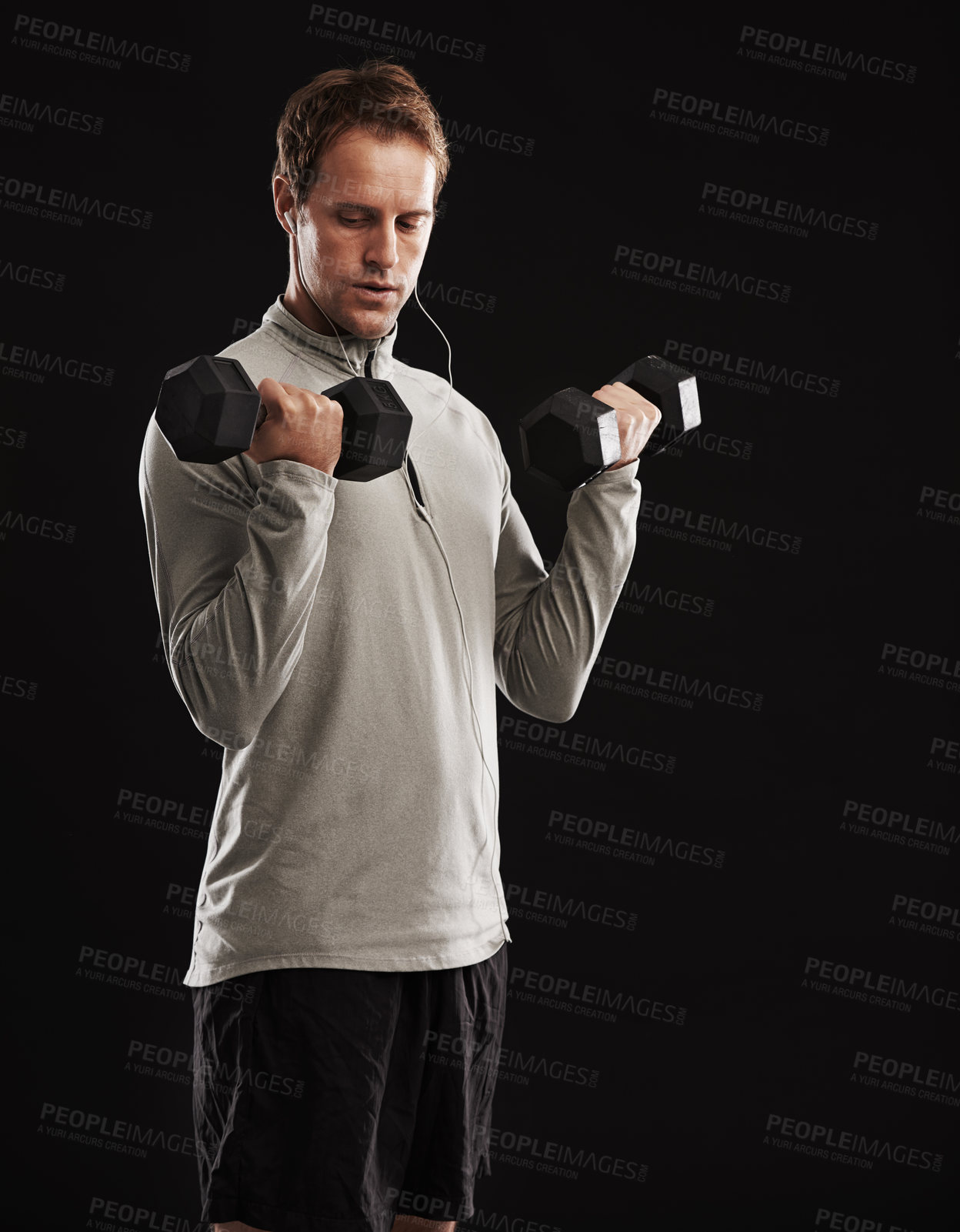 Buy stock photo Man, dumbbells and weightlifting training in studio or fitness performance, workout or black background. Male person, equipment and earphones for music playlist or healthy, streaming or mockup space