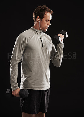 Buy stock photo Studio shot of a handsome young man in sportswear