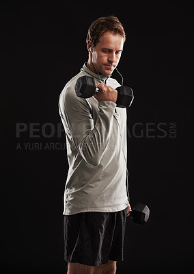 Buy stock photo Man, dumbbells and weightlifting exercise in studio or fitness performance, training or black background. Male person, equipment and earphones for music playlist or healthy, streaming or mockup space
