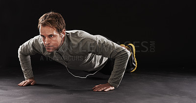 Buy stock photo Studio shot of a handsome young man in sportswear