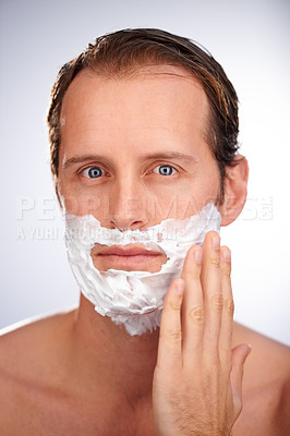Buy stock photo Man, portrait and shaving cream for beard in studio or hair removal maintenance, grooming or white background. Male person, face and product for healthy hygiene with skincare, dermatology or mockup