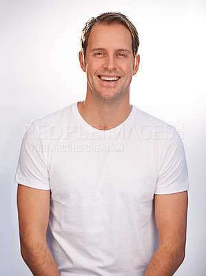 Buy stock photo Man, portrait and smile in studio for relax good mood with white background for positivity, mockup space or cheerful. Male person, face and model with happiness in Canada for carefree, calm or rest