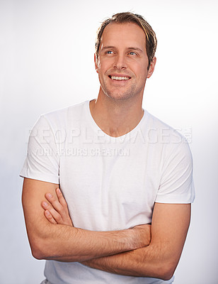Buy stock photo Cropped shot of a handsome man with folded arms