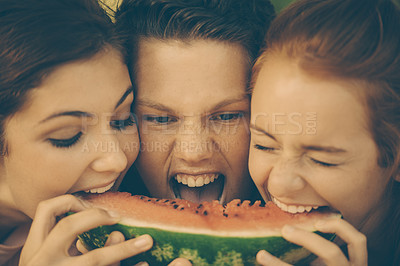 Buy stock photo Fun, friends and share watermelon for eating with closeup, crazy and group together for summer holiday. Gen z, people and bite fruit for hunger or nutrition, health and outdoor for bonding in sun