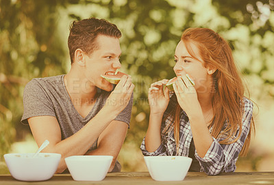 Buy stock photo Couple, happy and relax outdoors with watermelon for summer picnic for love, care and support in park. Gen z or teenager, boy and girl together with fruit in garden for date and bonding in sun