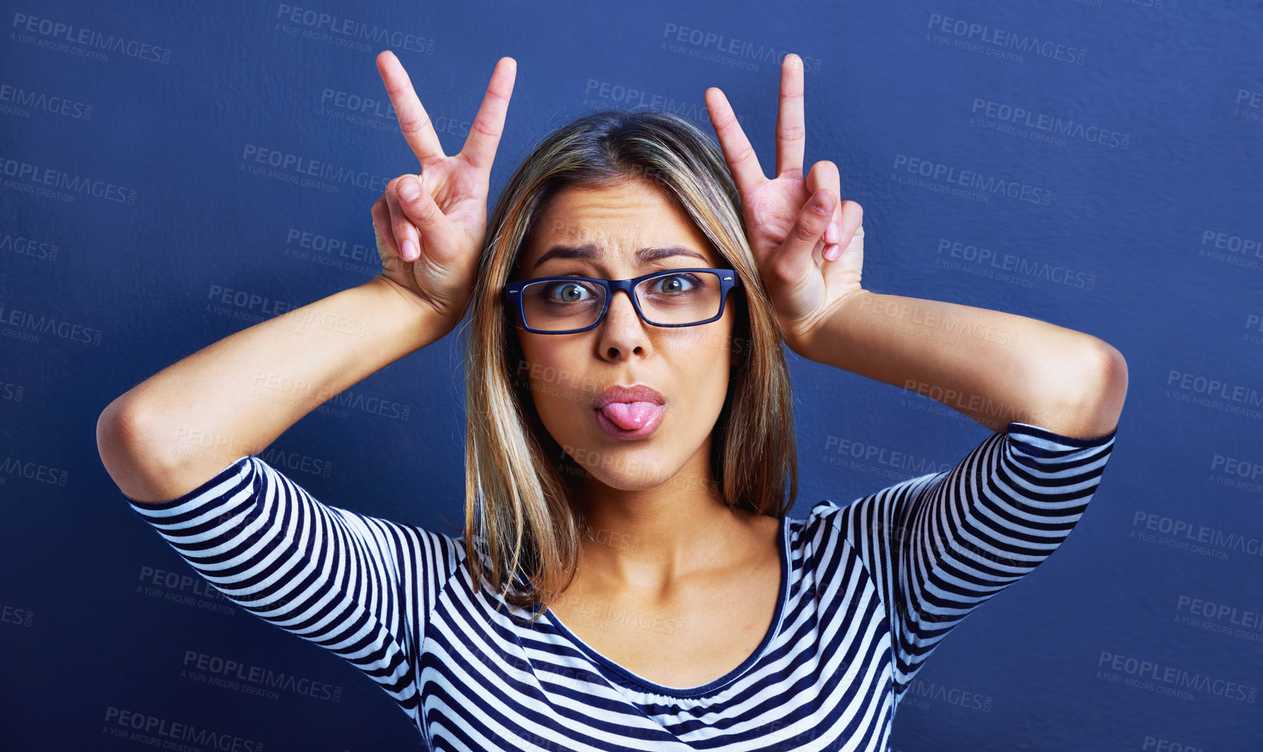 Buy stock photo Studio, funny faces and woman with peace sign on hands for promo or deal for clothes in fashion. Adult, female person and girl in blue background with glasses or eyewear, aesthetic and portrait