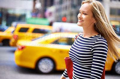 Buy stock photo Shot of a gorgeous woman walking in the city