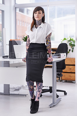 Buy stock photo Tattoos, portrait and business woman in office with positive, good and confident attitude. Grunge, pride and professional edgy female creative designer with ink skin standing in modern workplace.
