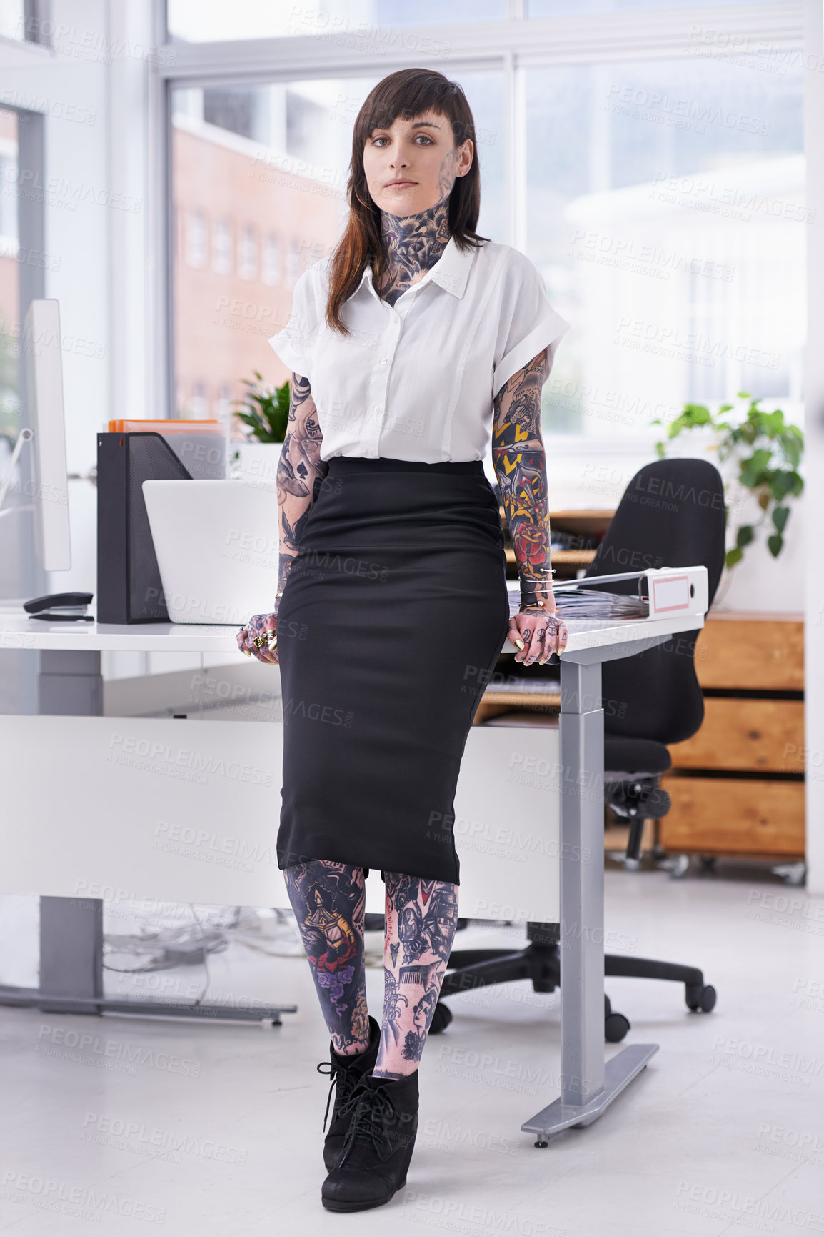 Buy stock photo Tattoos, portrait and business woman in office with positive, good and confident attitude. Grunge, pride and professional edgy female creative designer with ink skin standing in modern workplace.