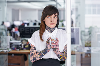 Buy stock photo Tattoos, coffee and portrait of business woman in office with positive, good and confident. Grunge, cappuccino and professional edgy creative designer with ink skin standing in modern workplace.