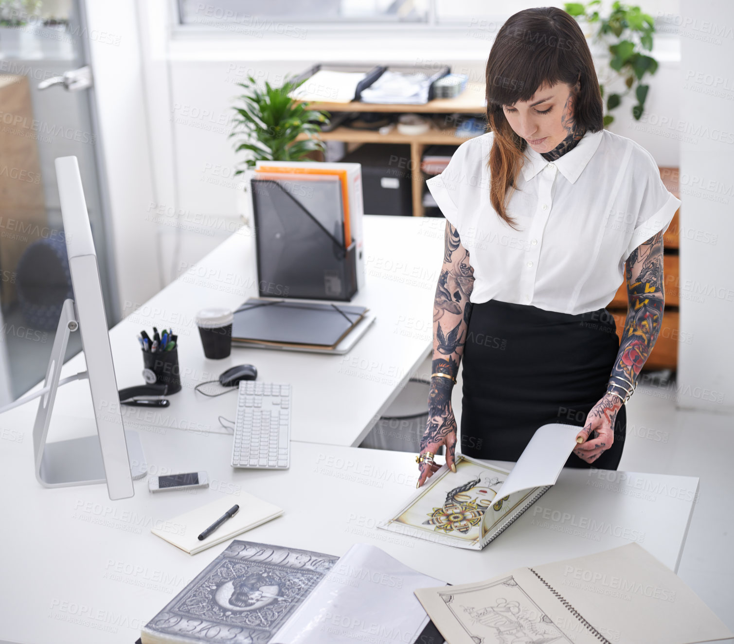 Buy stock photo Tattoo, woman and book in office for business with creative planning, design choice and sketch in folder. Entrepreneur, artist and ring binder with inspiration for body art and work project at desk