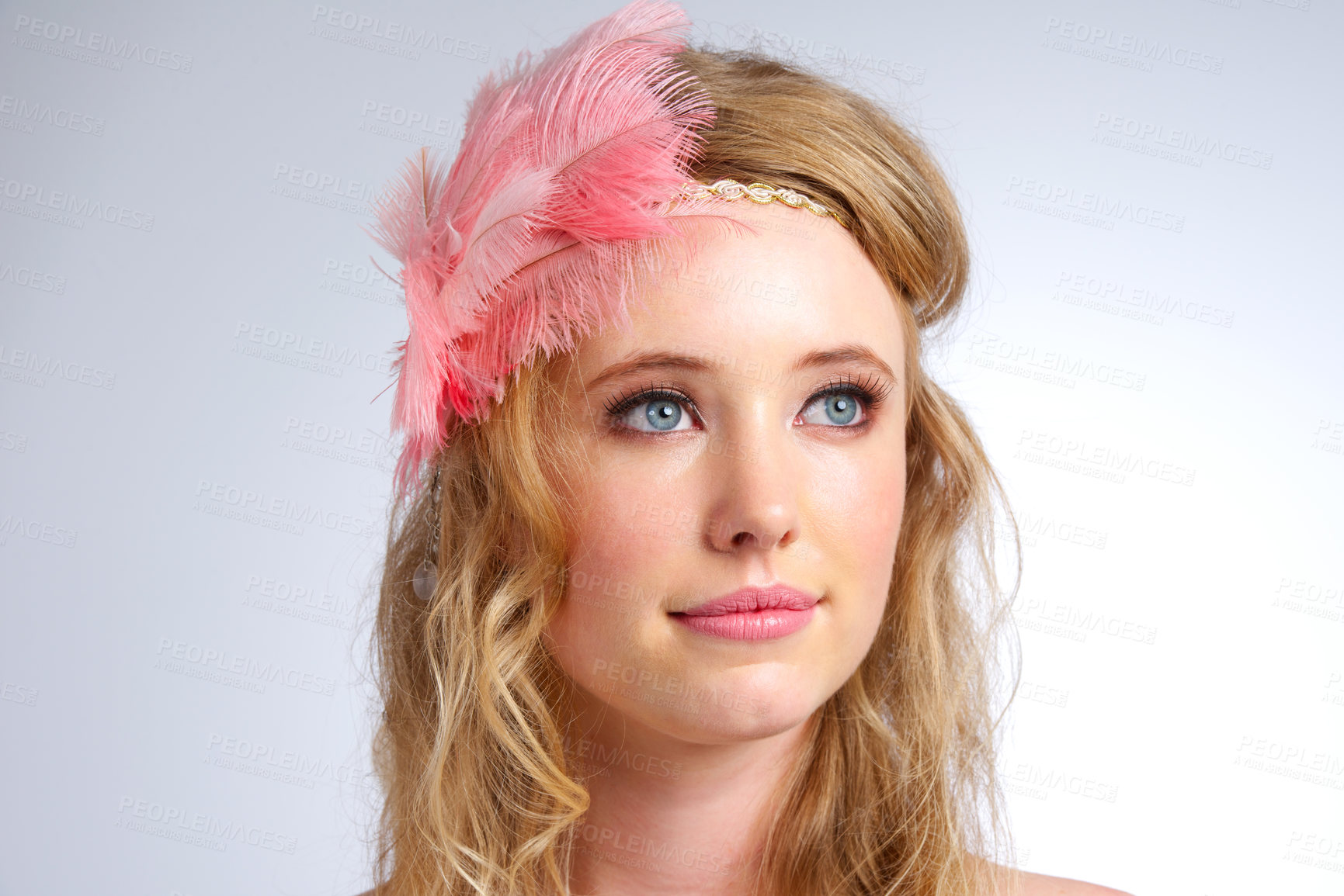Buy stock photo Studio shot of a beautiful young woman wearing a feathered headband