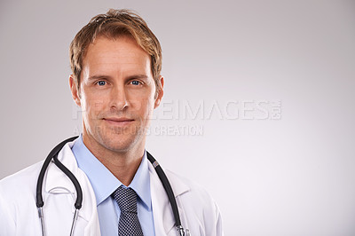 Buy stock photo Man, doctor and physician in studio, portrait and medical professional on gray background. Male person, healthcare and pride for cardiologist career, nurse and trustworthy specialist for medicare