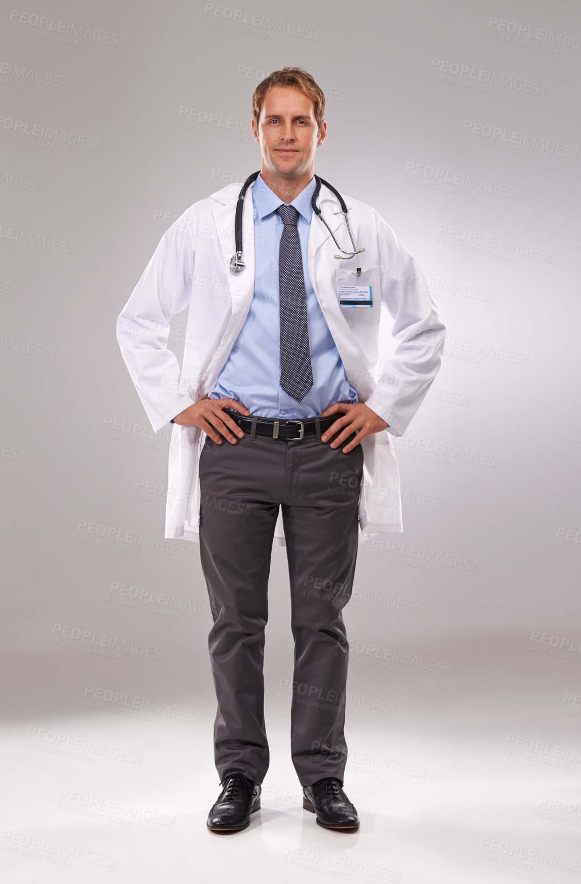 Buy stock photo Man, doctor and confident in studio, portrait and medical professional on gray background. Male person, healthcare and pride for cardiologist career, physician and trustworthy specialist for medicare