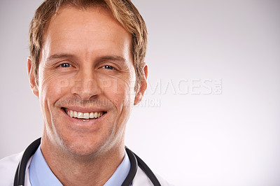Buy stock photo Man, doctor and portrait in studio, medical expert and specialist on gray background. Happy male person, cardiologist and proud of choice or decision on medicare, trustworthy physician and health