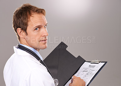 Buy stock photo Clipboard, documents and portrait of doctor in studio for medical research, insurance and report for hospital. Healthcare, clinic and man with paperwork for consulting and planning on gray background