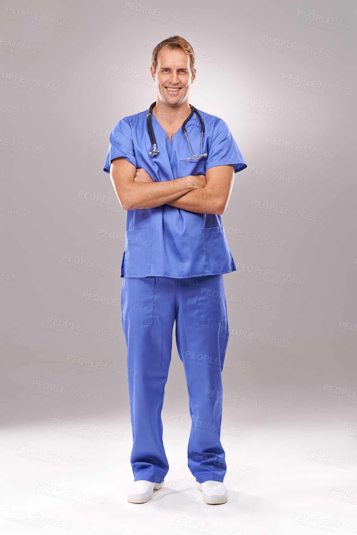 Buy stock photo Man, nurse and portrait in studio, confident expert and specialist on gray background. Happy male person, cardiologist and proud of medicare on mockup space, trustworthy physician and professional