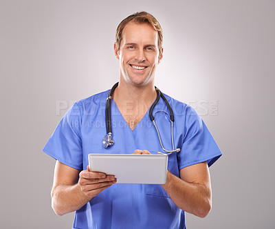 Buy stock photo Tablet, doctor and portrait of man in studio for medical research, insurance and report for hospital. Healthcare, clinic and worker on tech for consulting, telehealth and internet on gray background