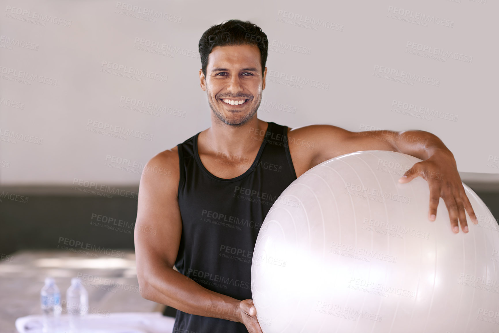 Buy stock photo Portrait, happy man and pilates ball for exercise, workout or training in gym for healthy body in Brazil. Face, smile and person with equipment for sport, wellness or fitness for physical activity