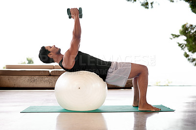 Buy stock photo Man, dumbbell and exercise ball on yoga mat or flexibility training for healthy mobility, fitness or weightlifting. Male person, equipment and workout strength for sport challenge, gym or balance