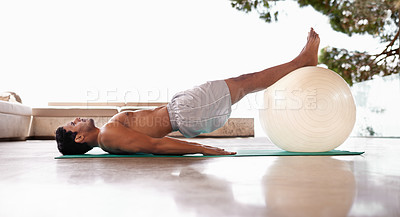 Buy stock photo Man, stretching and exercise ball on yoga mat or flexibility training for healthy mobility, fitness or wellness. Male person, equipment and workout strength in home or sport challenge, gym or balance