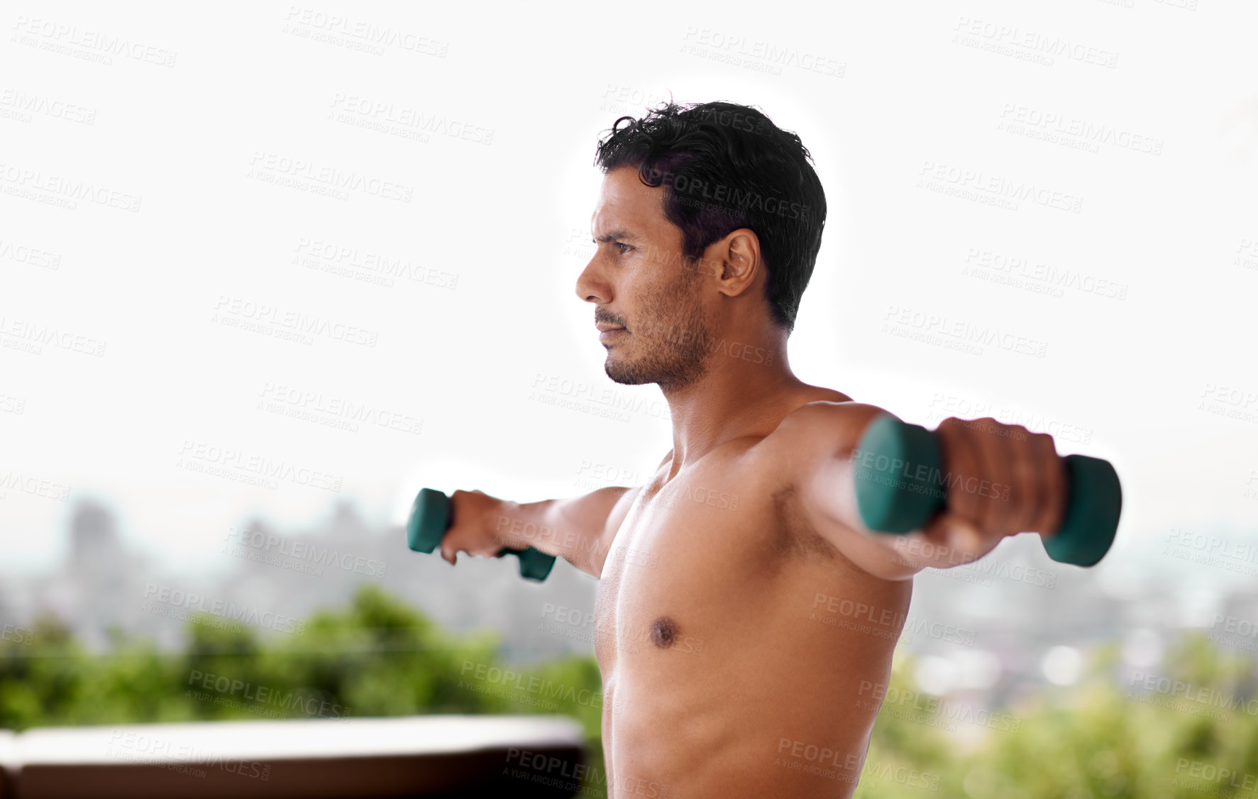 Buy stock photo Shot of a handsome man exercising with dumbbells