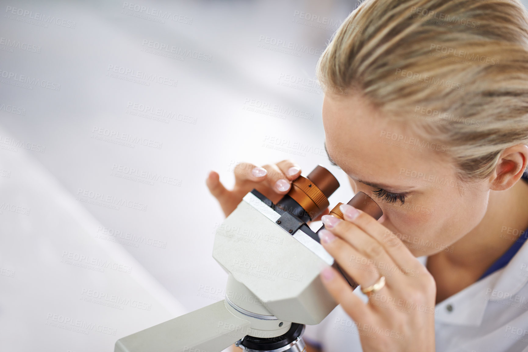 Buy stock photo Woman, research and scientist with microscope for exam, test or scientific discovery at laboratory. Face of female person or medical expert looking in zoom lens or scope for breakthrough in biology