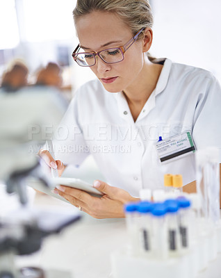 Buy stock photo Reading, research and woman with tablet in medical laboratory with development in biotechnology. Scientist, typing or check results online of pharmaceutical report or review of innovation in science