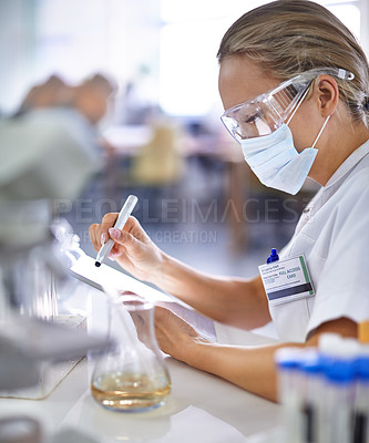 Buy stock photo Woman, scientist and writing with mask for research, checklist or test results from experiment at laboratory. Female person or medical professional takings notes in exam or trial on chemical compound