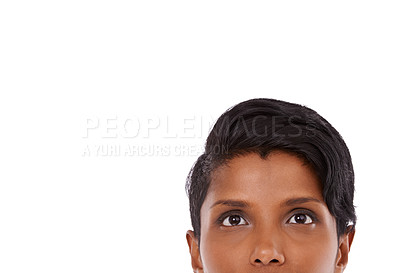 Buy stock photo A young woman looking up thoughtfully