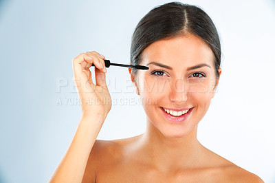 Buy stock photo Brush, mascara and woman in portrait with makeup for beauty, transformation and lashes on white background. Face, smile and hand with wand for eyelash change, tools and cosmetic product in studio